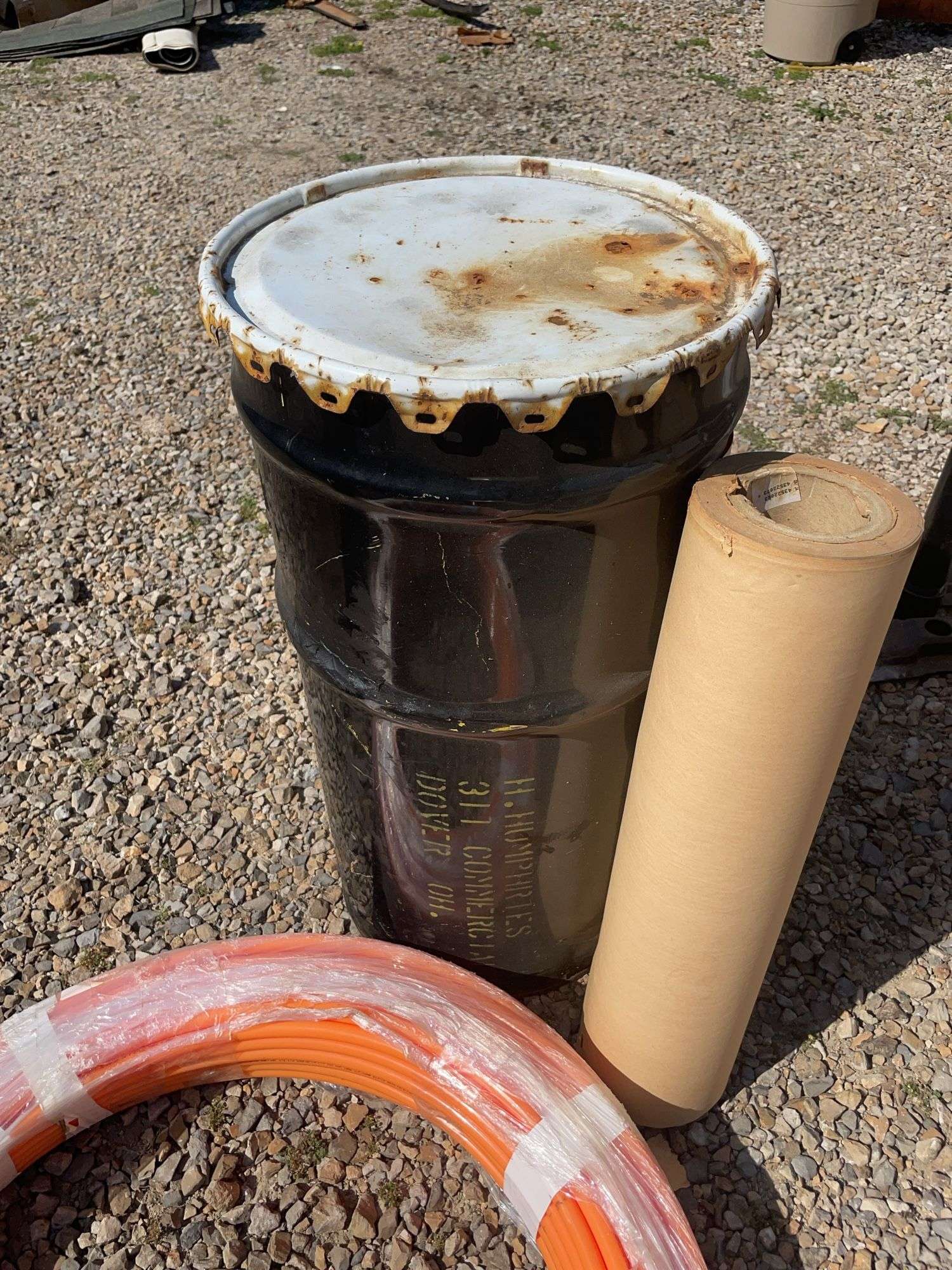 Metal drum, Pex tubing, vacuum hose and Fuller Brikarier brick carrier