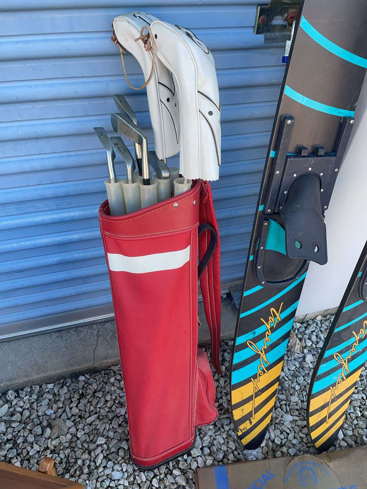 Golf bag with misc. clubs, skis and horseshoe game