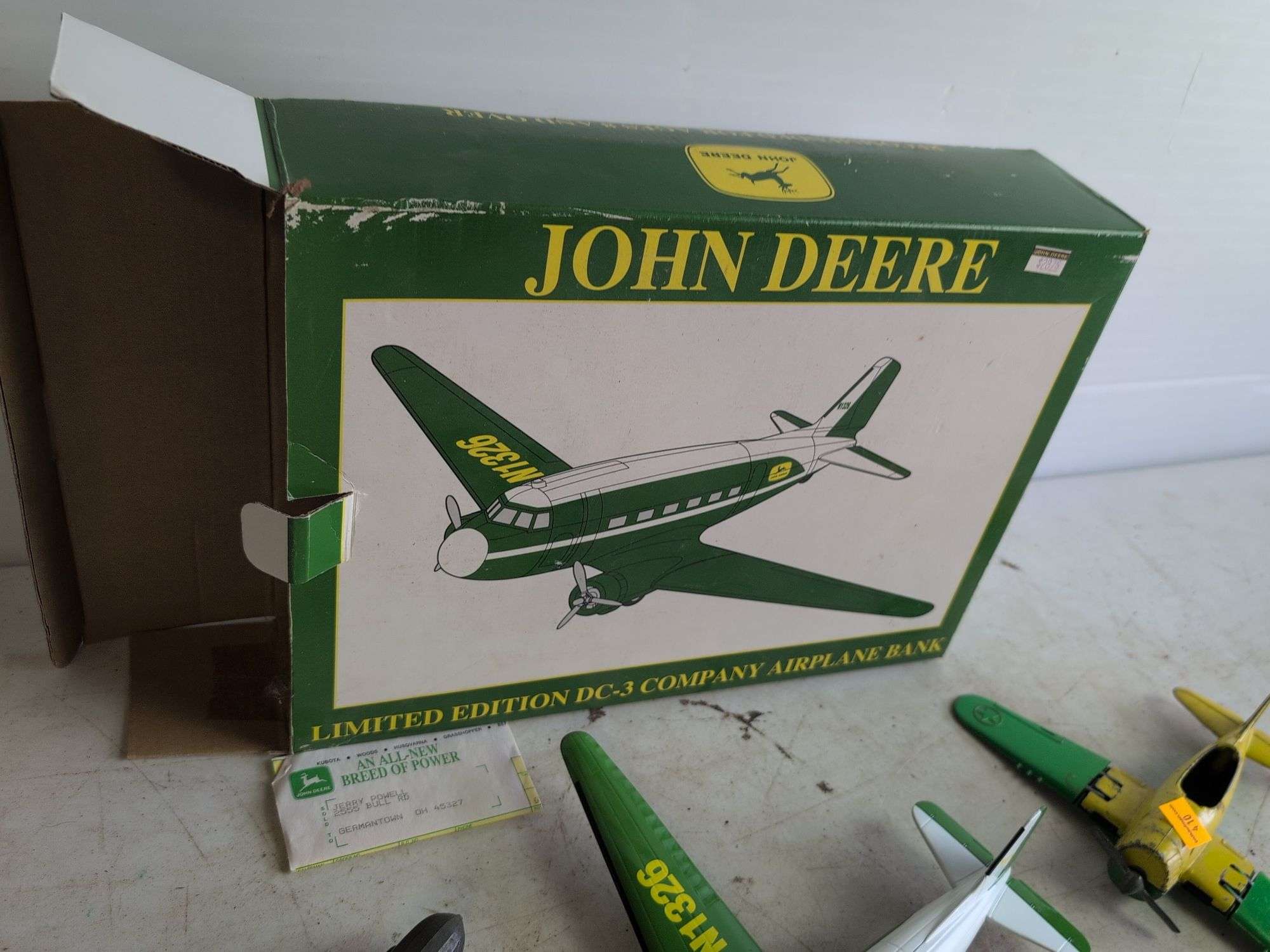 John Deere airplane bank and (2) other metal plane toys