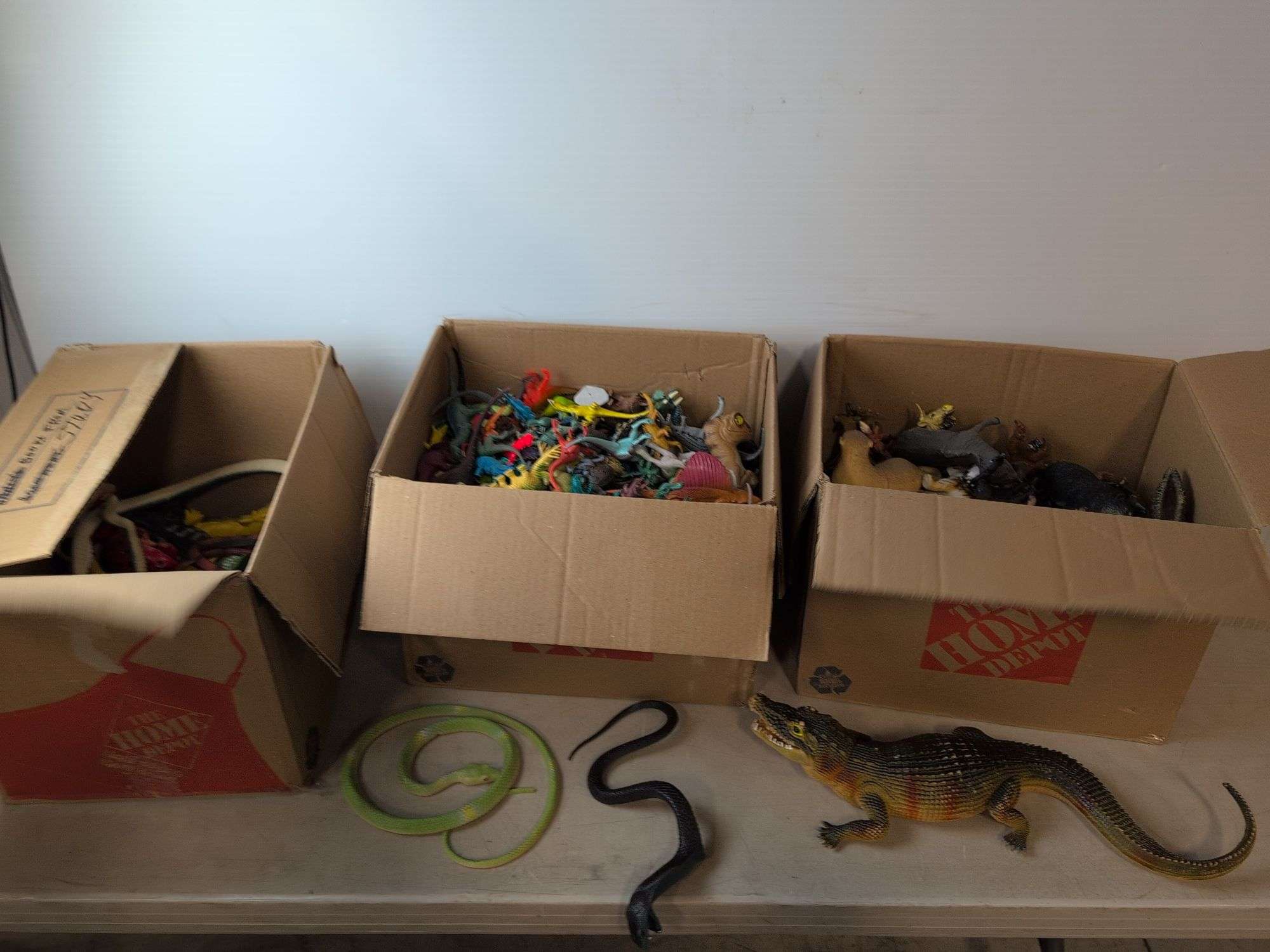 (4) boxes of toy animals