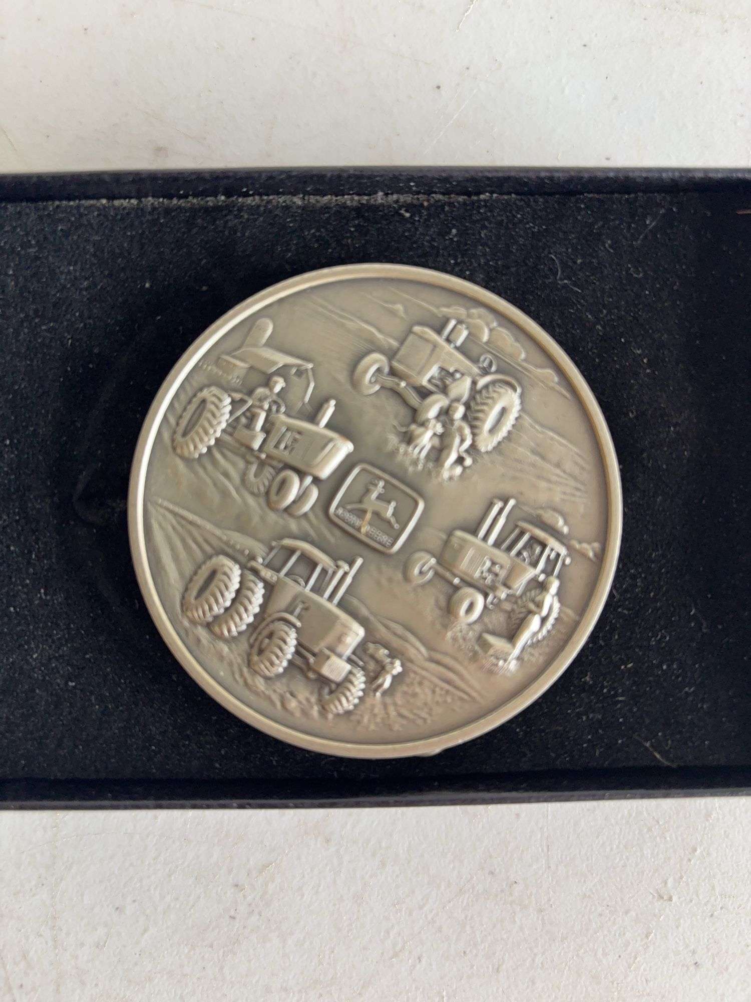 (4) John Deere belt buckles