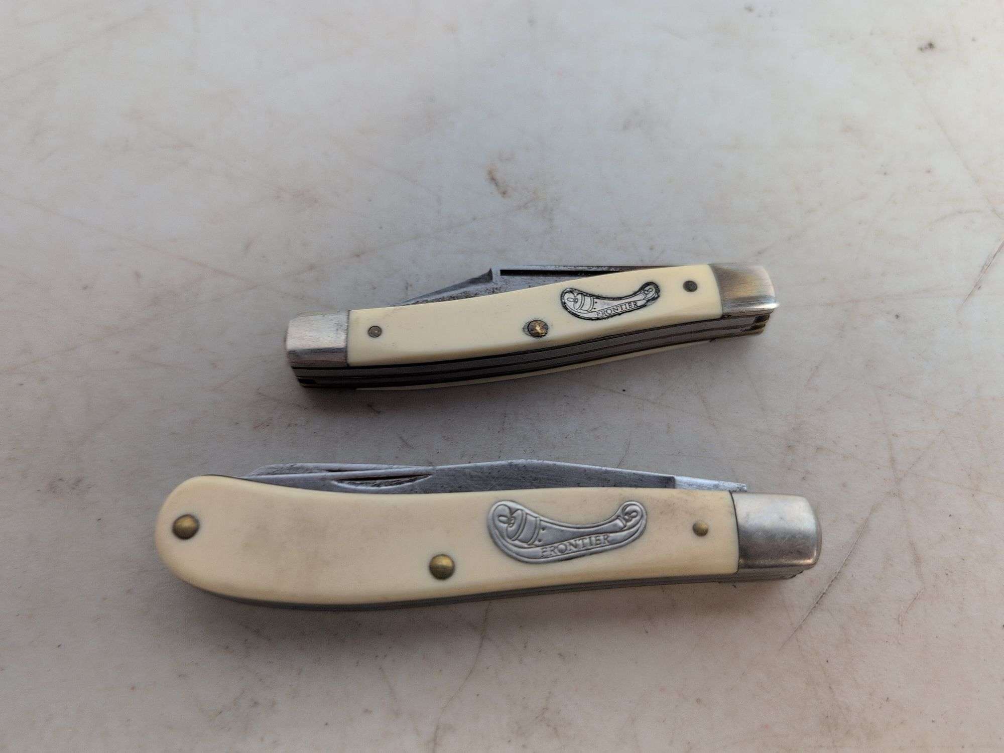 (2) Frontier pocket knives