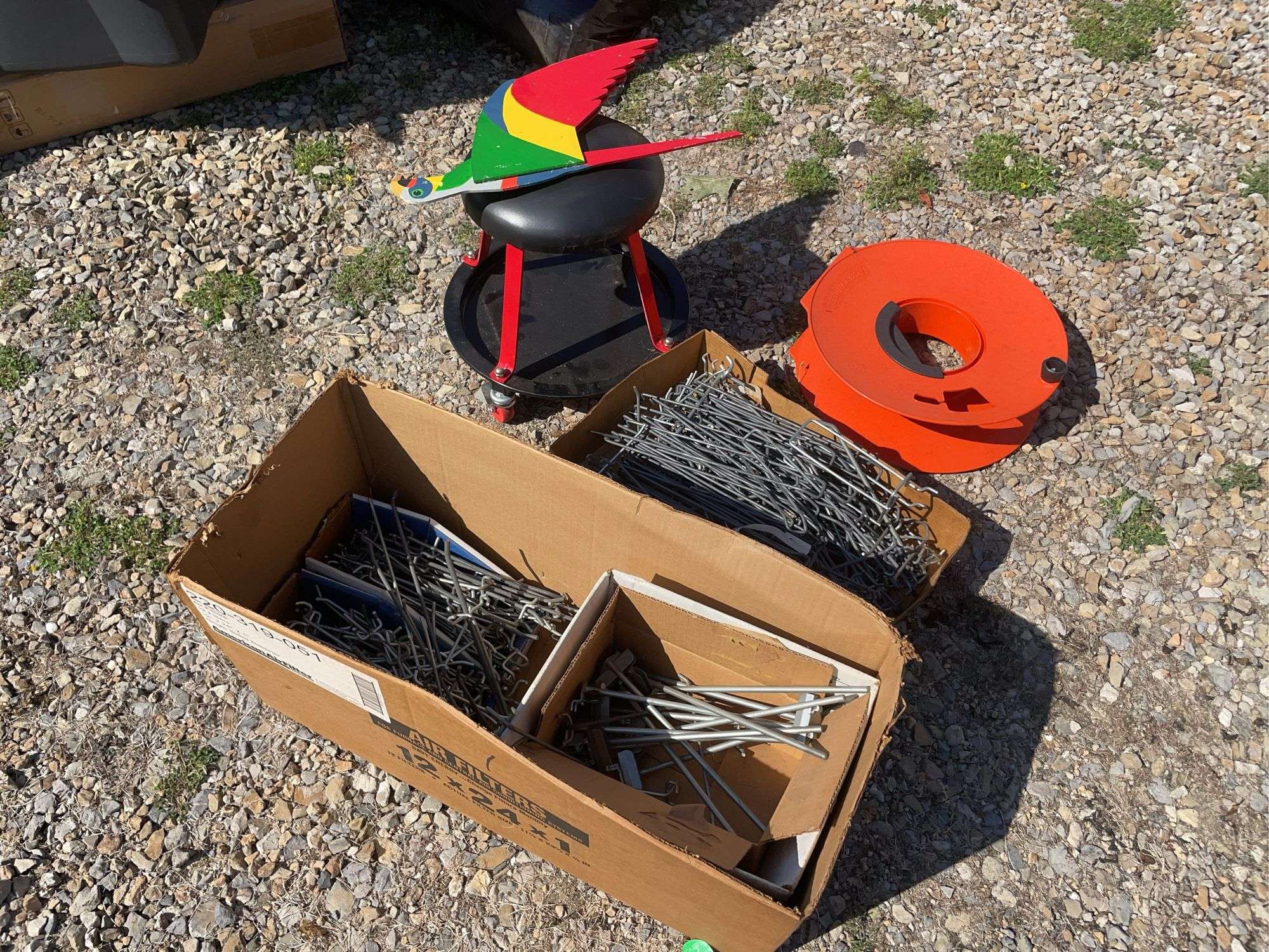 (2) boxes of hooks/shelving, mechanics chair and cord wheel