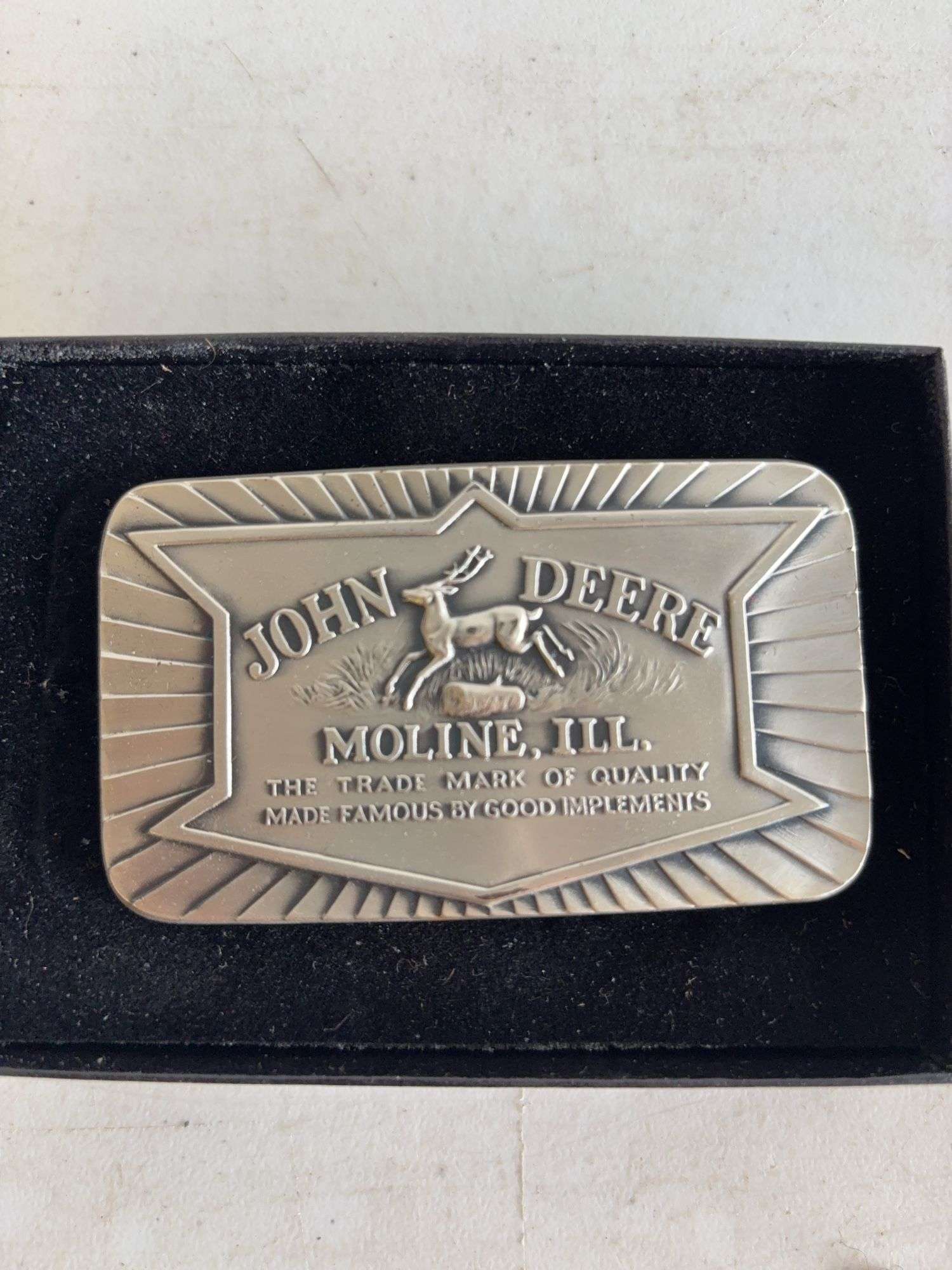 (4) John Deere belt buckles