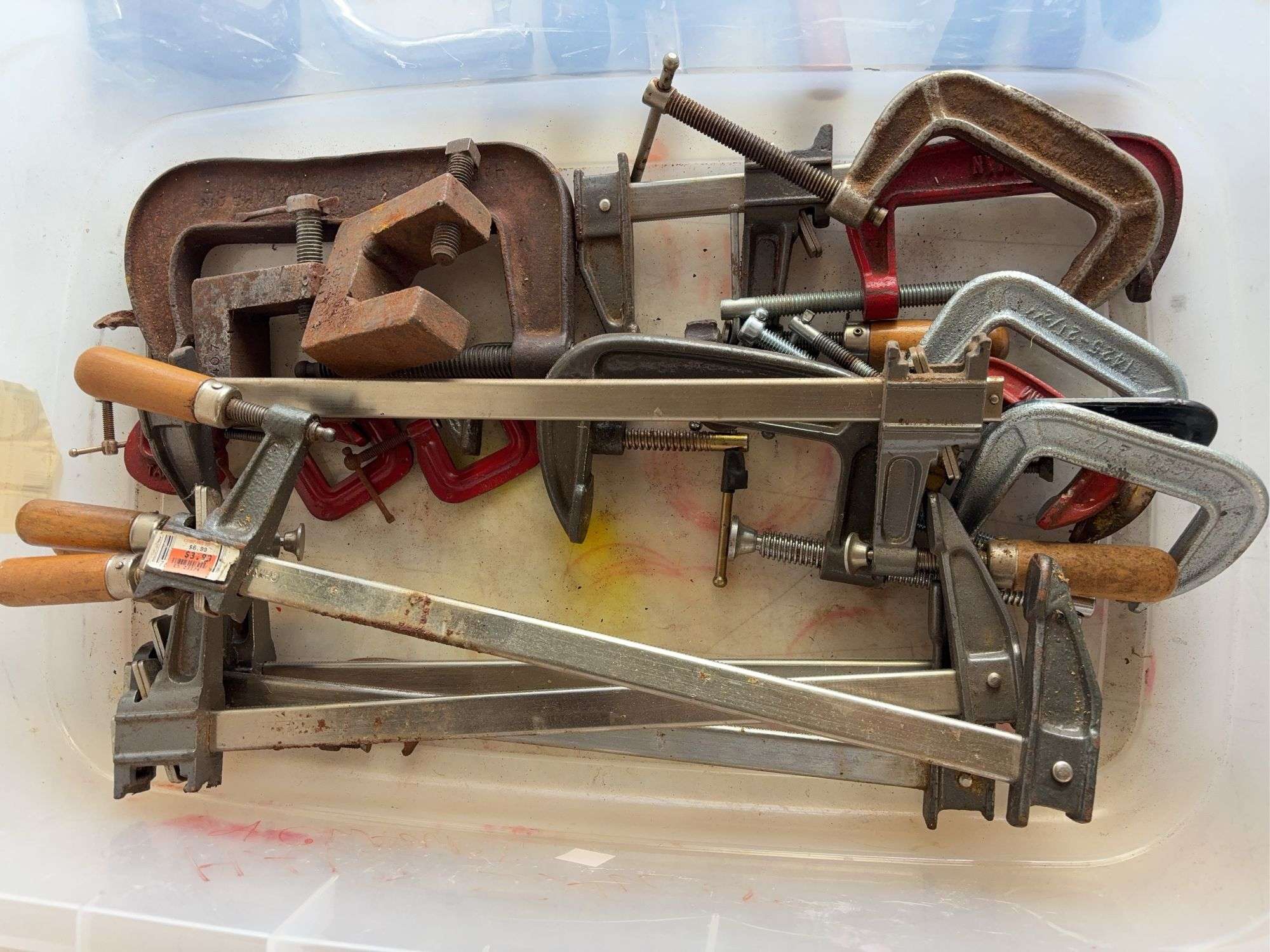 Tote of hand saws and clamps