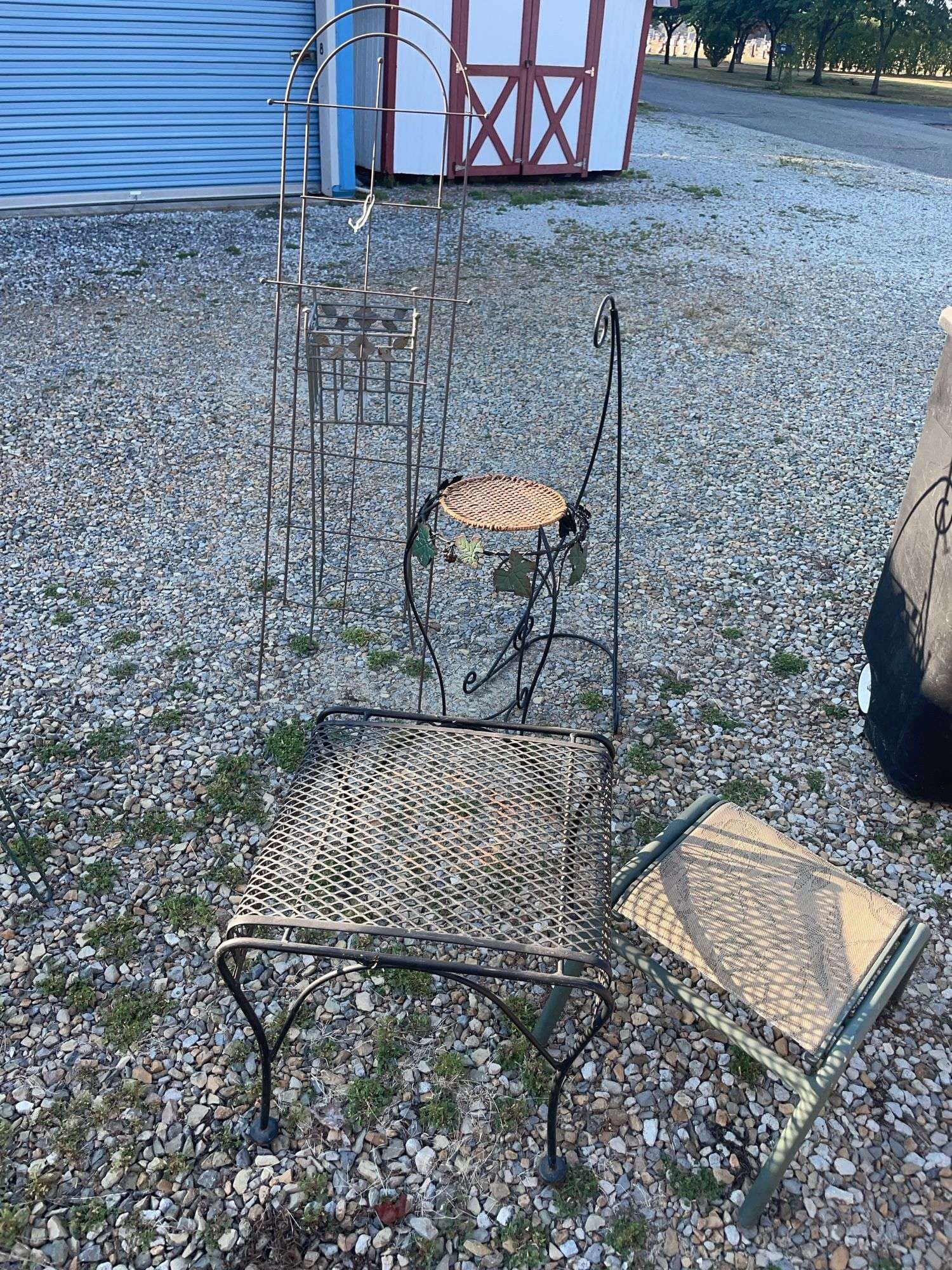 Assortment of garden decor/ plant stands, hanging basket hook and more