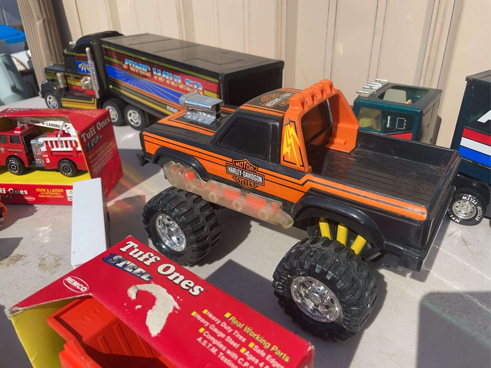 Box of toy cars/ trucks