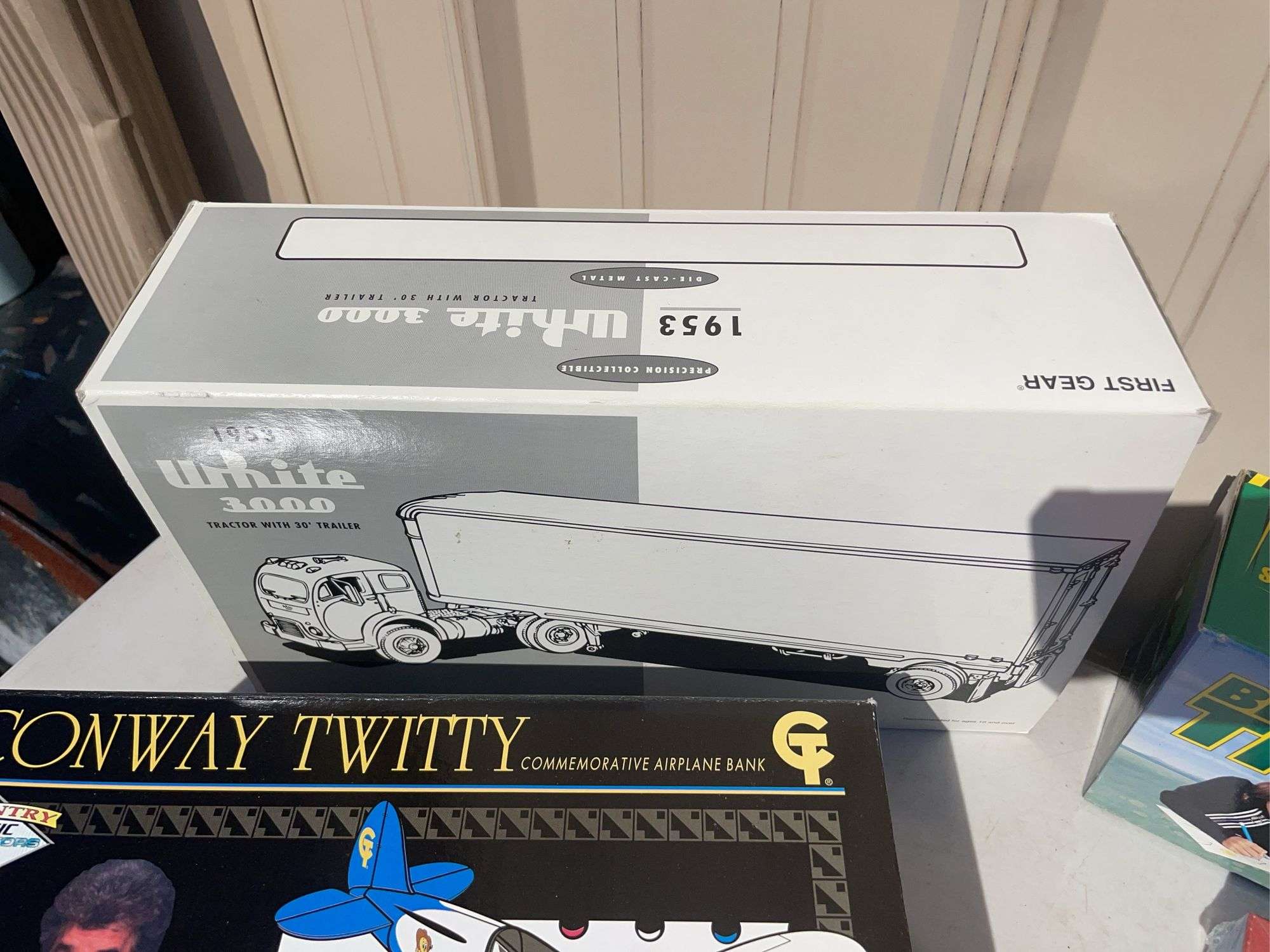 Box of mostly new cars/ toys including hot rod hauler, racing Champions car, BP Chopper Truck and mo