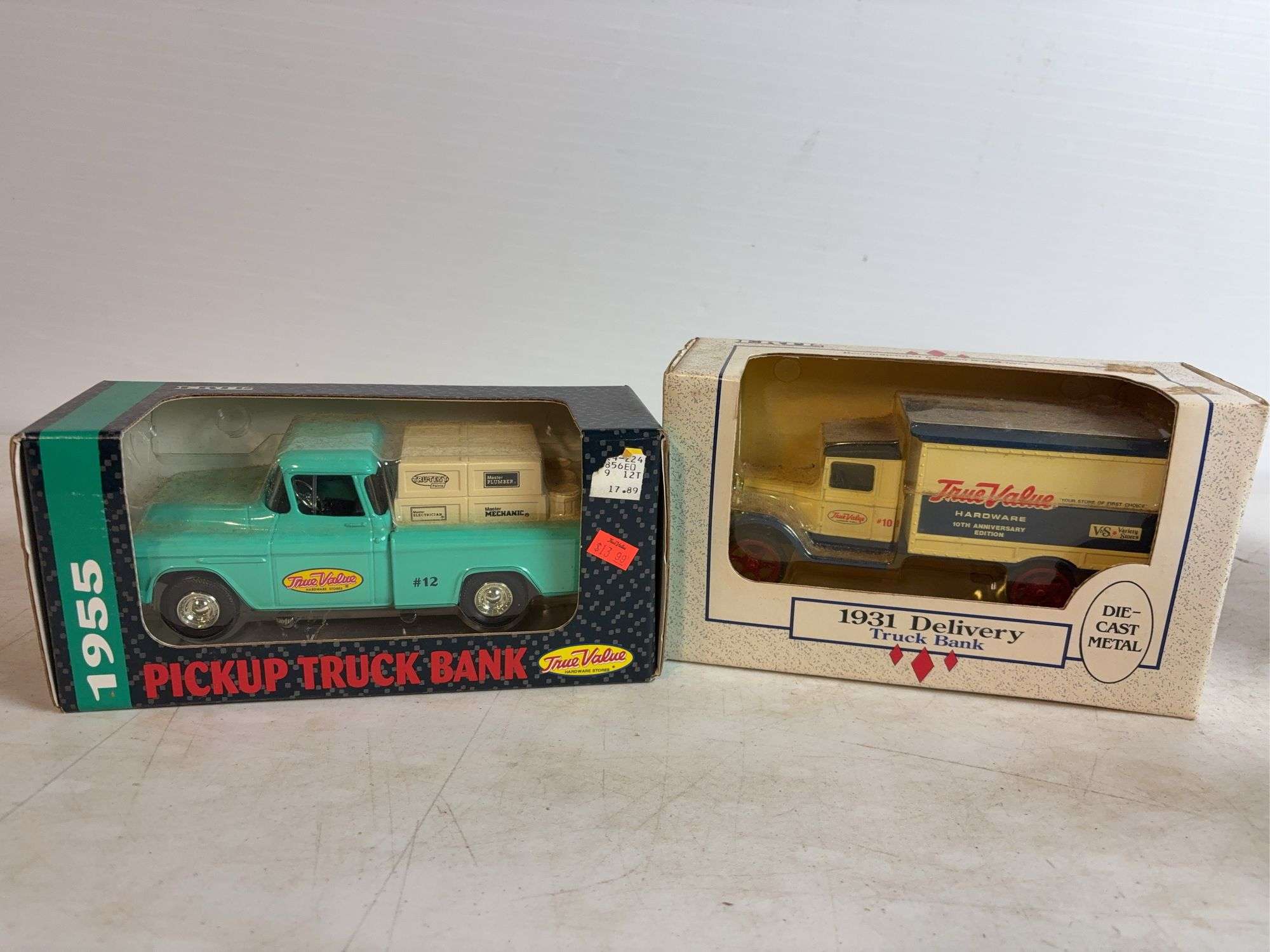 (2) True Value model truck banks - 1/25 and 1/34 scale, dirty
