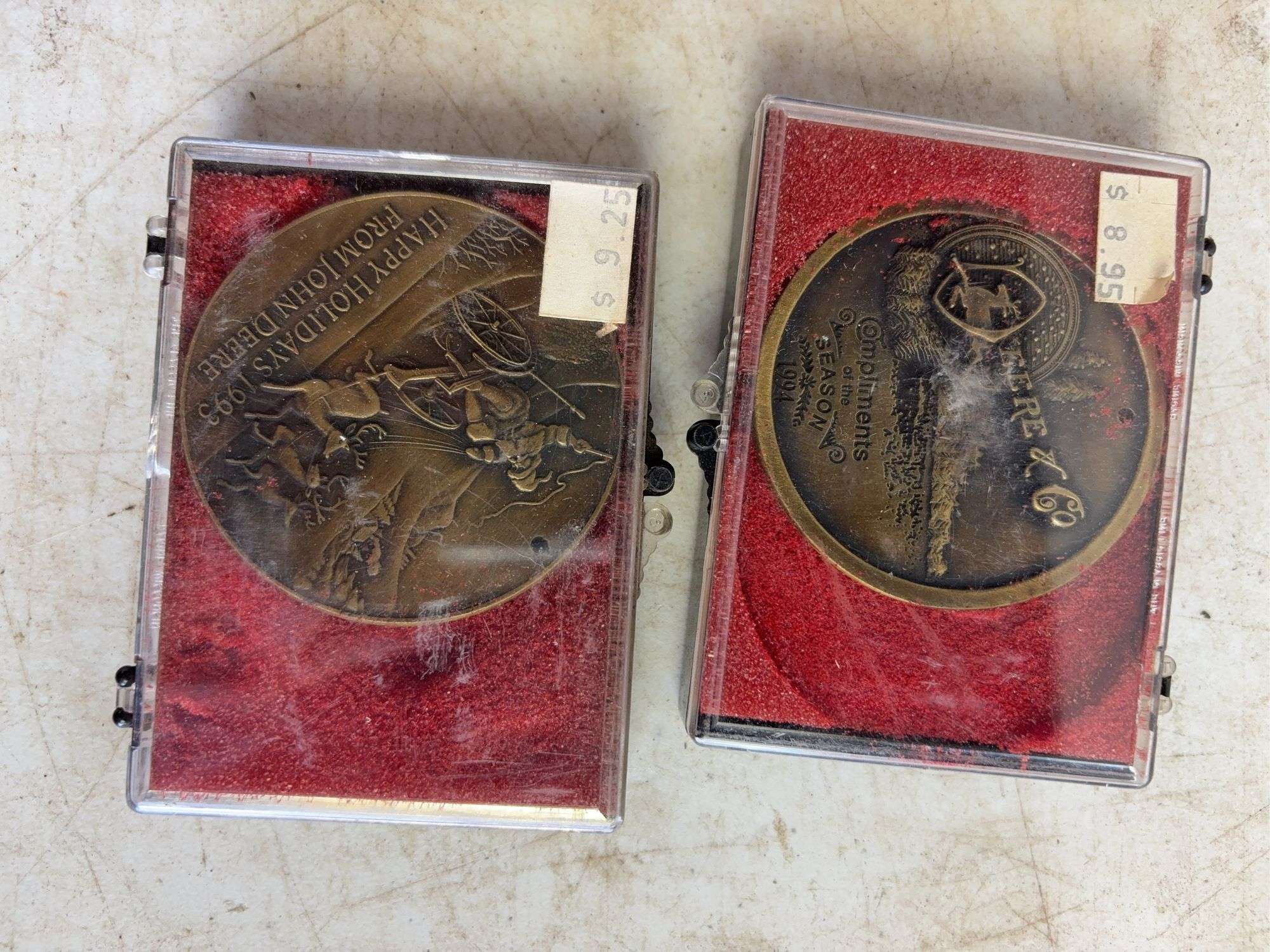 (6) John Deere belt buckles and (2) holiday coins