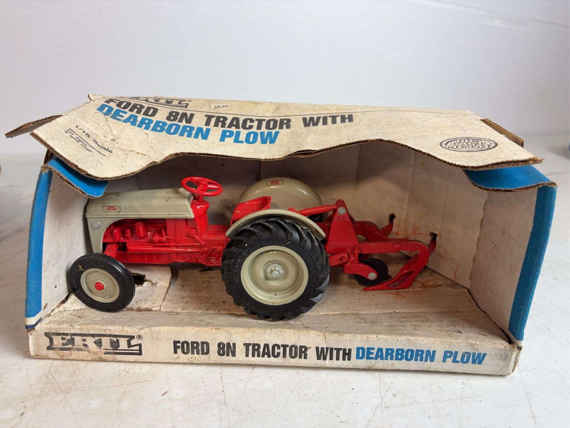 Ford 8N die-cast model tractor with Dearborn plow and other Ford tractor - 1/16 scale, dirty