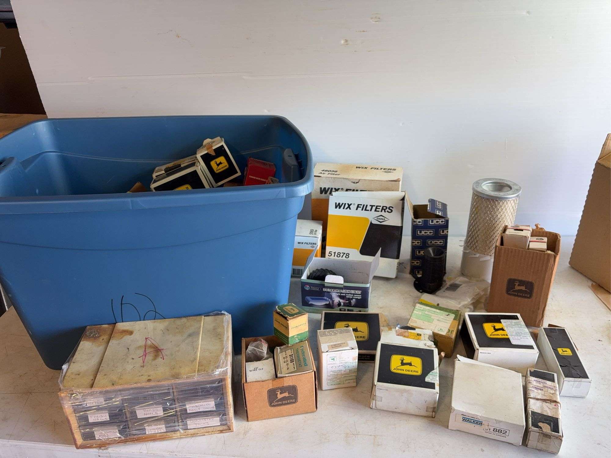 Tote of filters, parts, and more - John Deere, Wix, etc