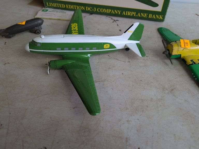 John Deere airplane bank and (2) other metal plane toys
