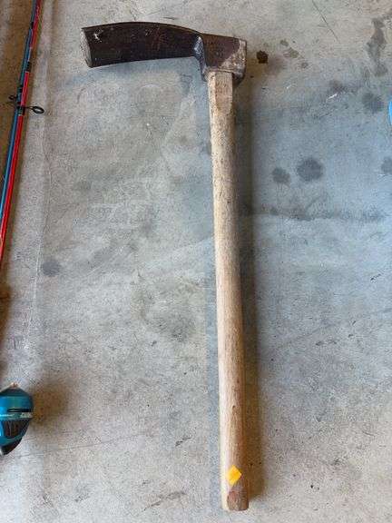 Post hole digger, adze, and (2) fishing poles
