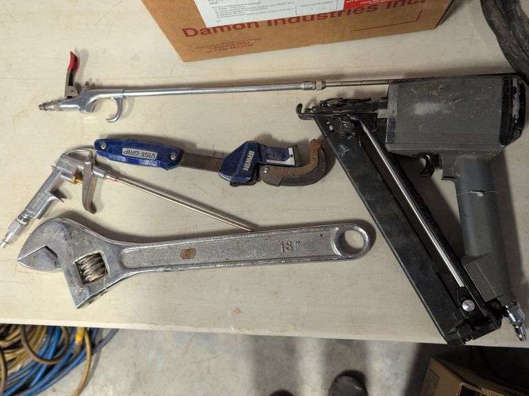 Nail gun, 18" adjustable wrench, and other tools