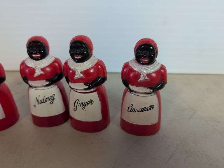 (4) plastic black Americana spice containers