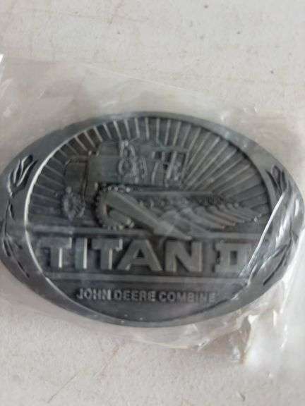 (4) John Deere belt buckles