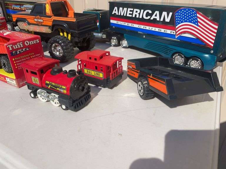 Box of toy cars/ trucks