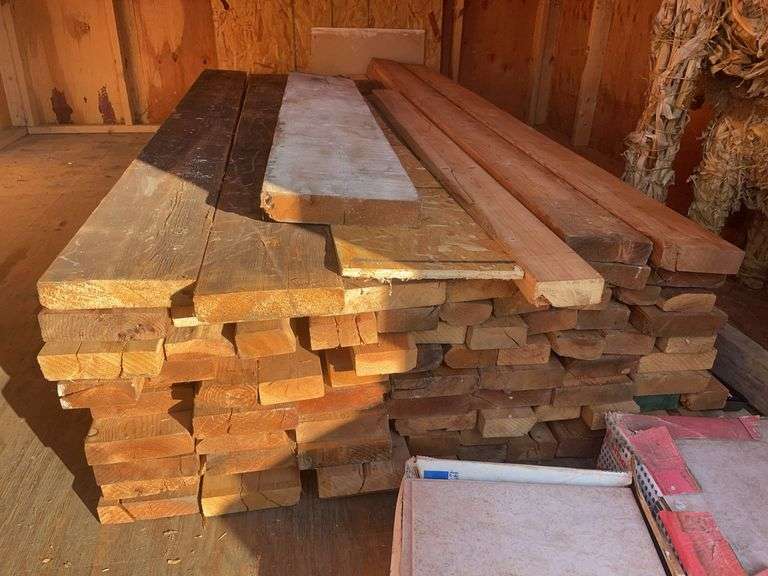 Large pile of wood and misc. tile flooring