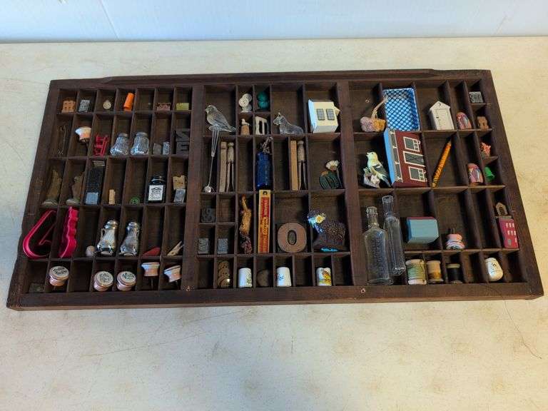 Shadow box with various vintage items - glass figures, print type blocks, and more