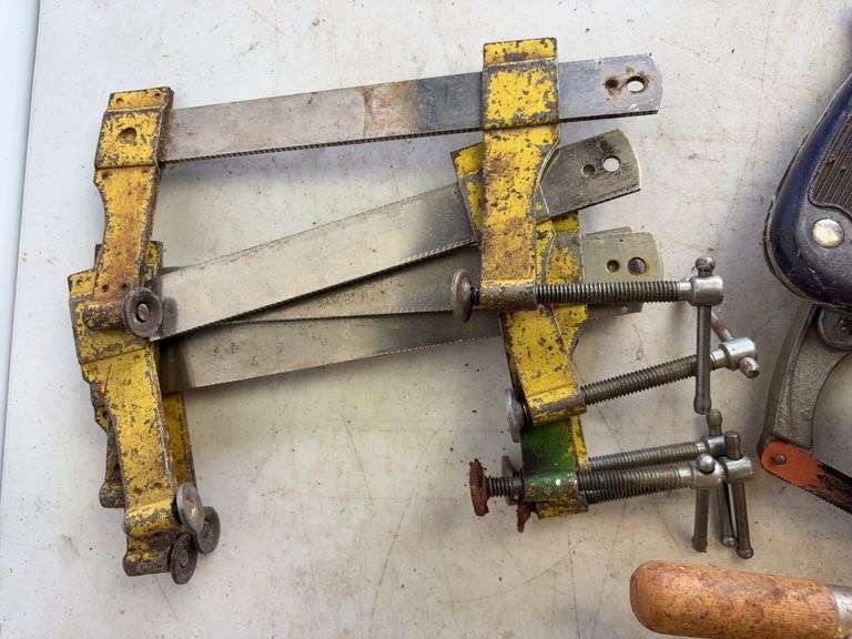 Tote of hand saws and clamps
