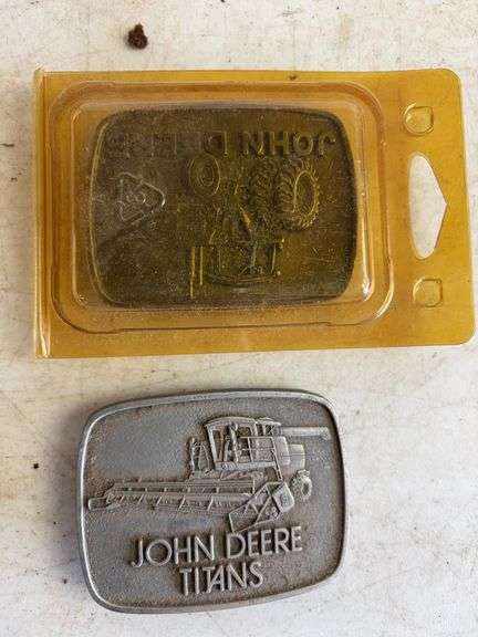 (6) John Deere belt buckles and (2) holiday coins