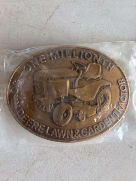 (4) John Deere belt buckles