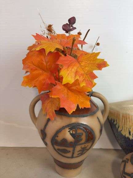 Vases with silk flowers, cups, and more