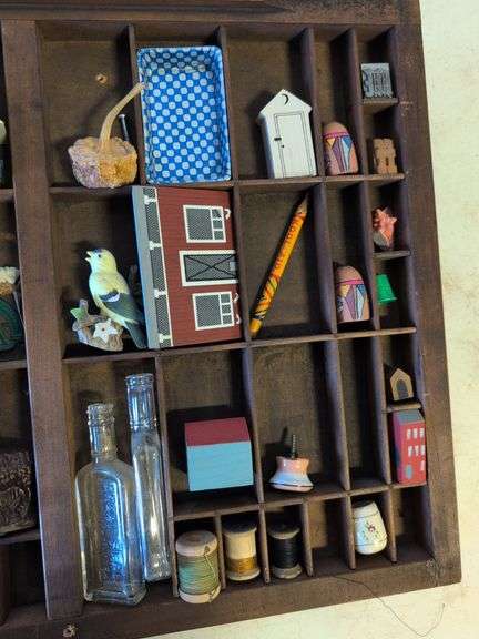 Shadow box with various vintage items - glass figures, print type blocks, and more
