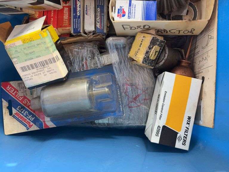 Tote of filters, parts, and more - John Deere, Wix, etc