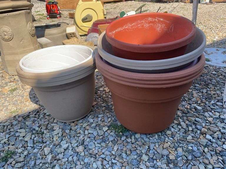Large lot of outdoor items including fountains, garden hose with reel, plant stand, basket, planters