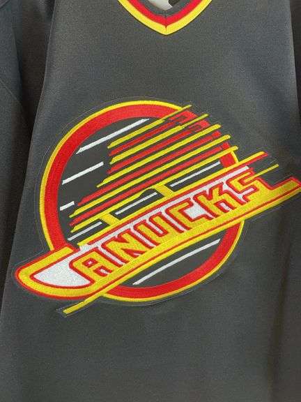 Vancouver Canucks authentic collection Hockey jersey, size 48