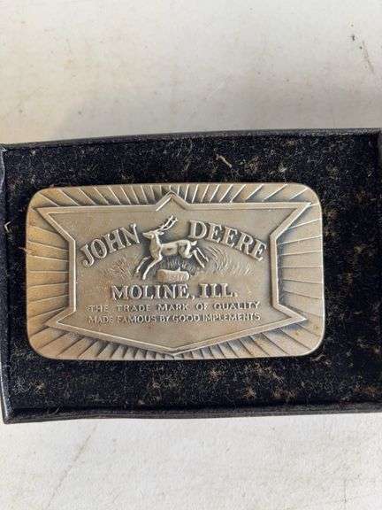 (4) John Deere belt buckles
