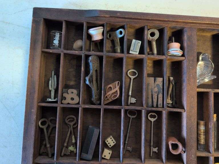 Shadow box with various vintage items - glass figurines, keys, pins, and more