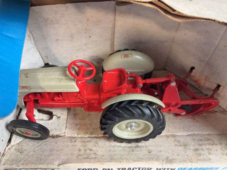 Ford 8N die-cast model tractor with Dearborn plow and other Ford tractor - 1/16 scale, dirty