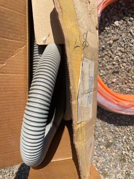 Metal drum, Pex tubing, vacuum hose and Fuller Brikarier brick carrier