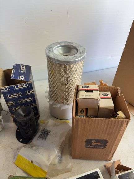 Tote of filters, parts, and more - John Deere, Wix, etc