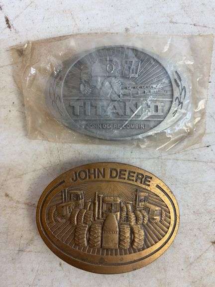 (6) John Deere belt buckles
