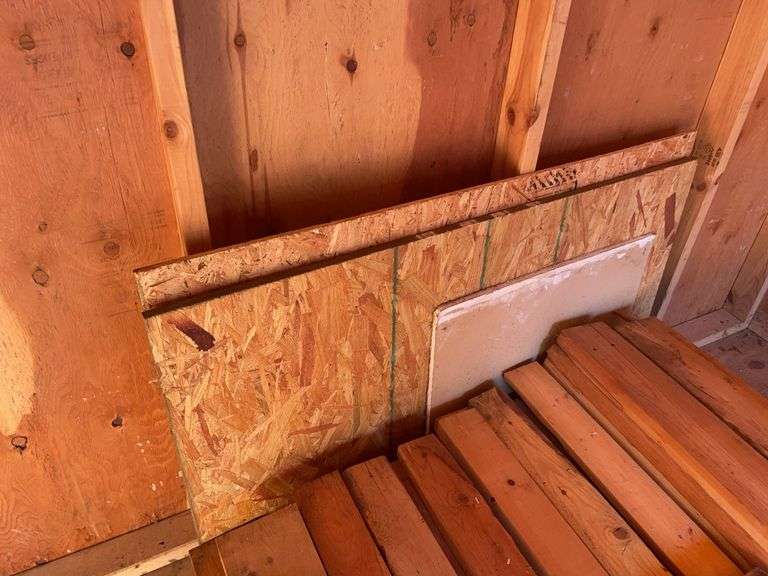 Large pile of wood and misc. tile flooring