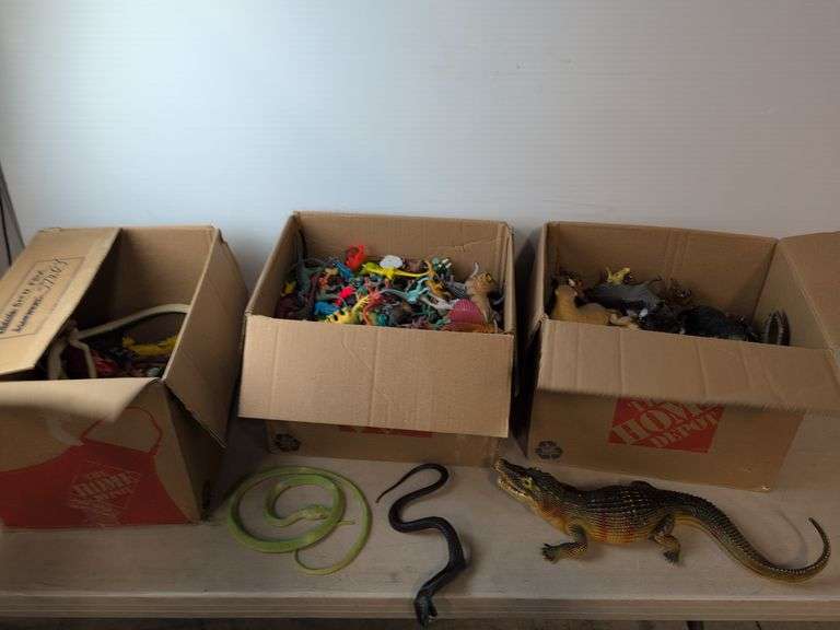 (4) boxes of toy animals