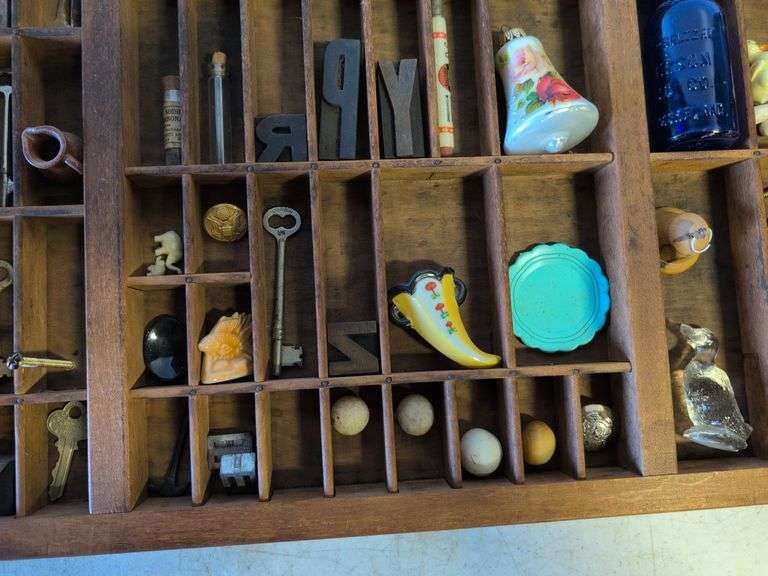 Shadow box with various vintage items - glass figurines, keys, pins, and more