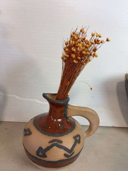 Vases with silk flowers, cups, and more