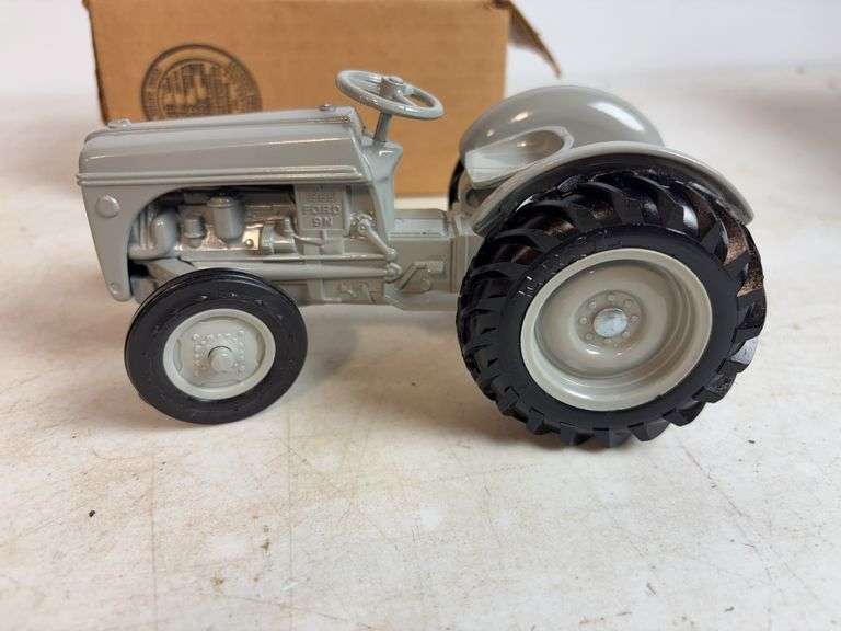Ford 8N die-cast model tractor with Dearborn plow and other Ford tractor - 1/16 scale, dirty