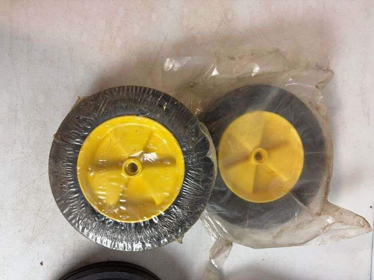Miscellaneous John Deere items - (4) wheels, toy booklets, and more