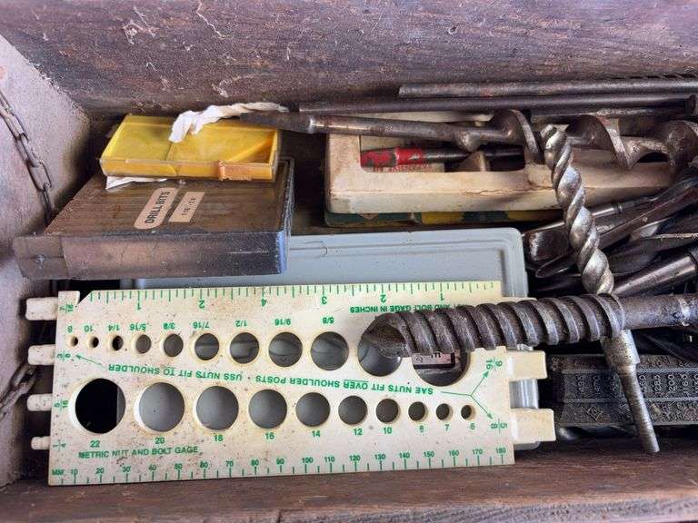 Wooden crate of miscellaneous drill bits
