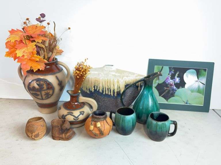 Vases with silk flowers, cups, and more