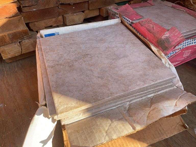 Large pile of wood and misc. tile flooring