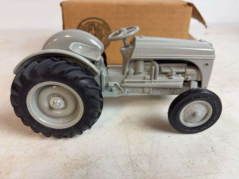 Ford 8N die-cast model tractor with Dearborn plow and other Ford tractor - 1/16 scale, dirty