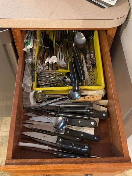 Drawer of utensils and drawer of lids and measuring cups