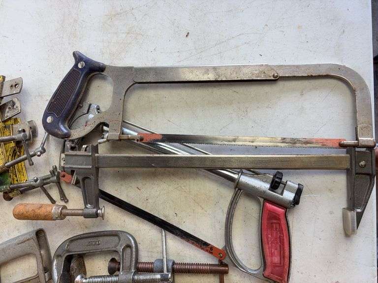 Tote of hand saws and clamps